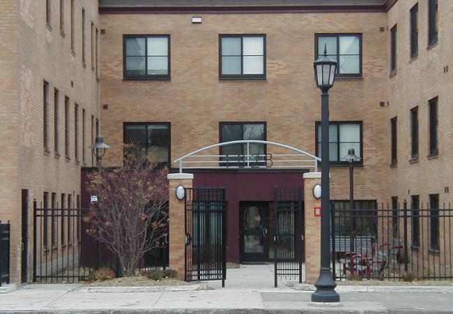 Apartment building front courtyard and gate
