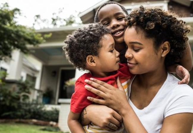 Parent with two happy children.