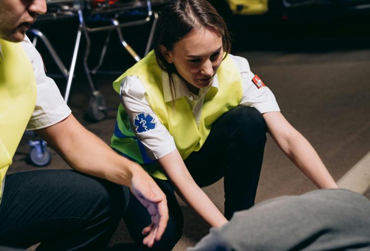 Two emergency medical technicians responding to a call for help.